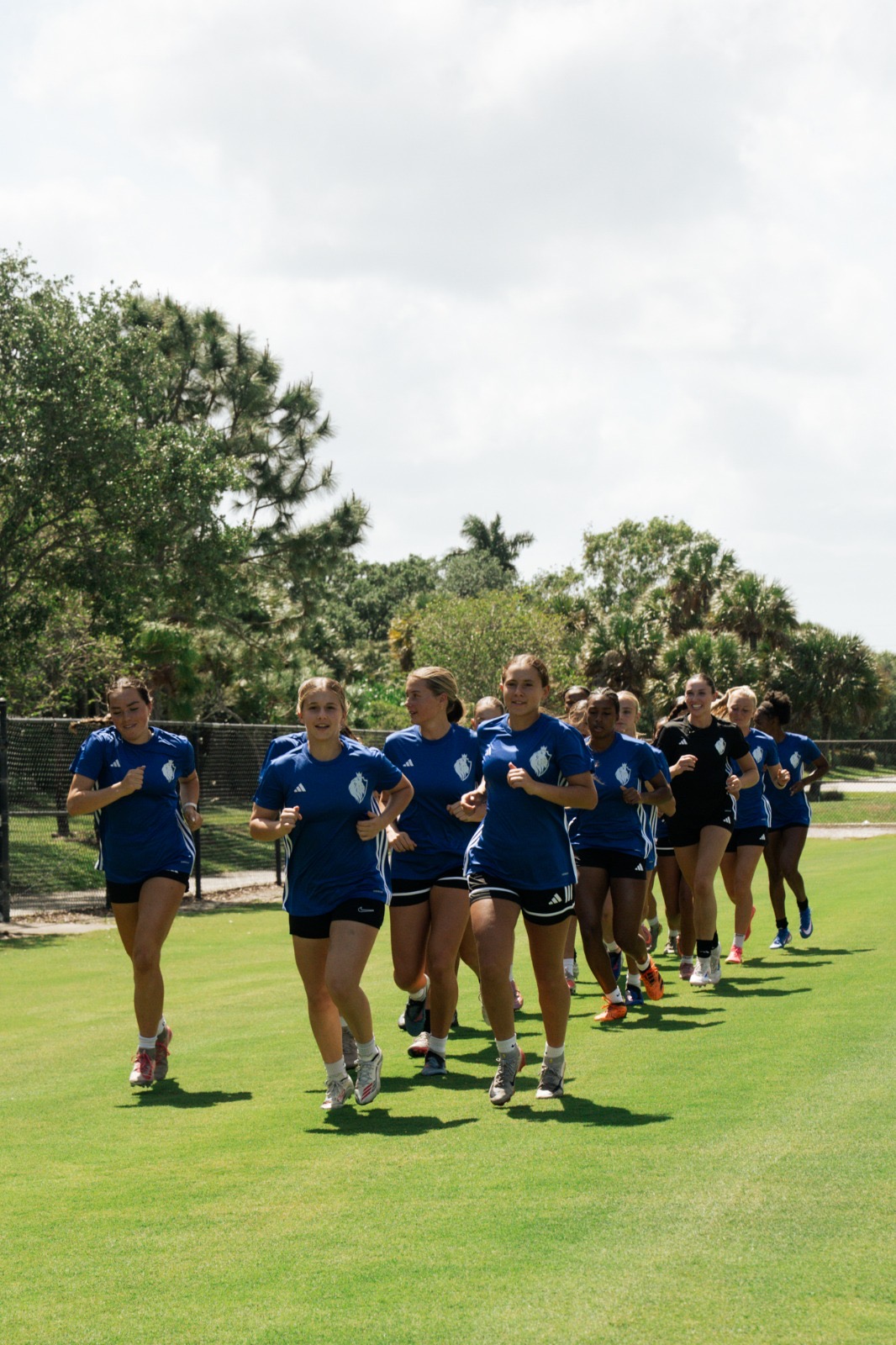 Players running together on the field